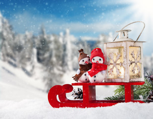 Winter snowy scenery with snow men