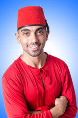 Man in traditional turkish hat and dress