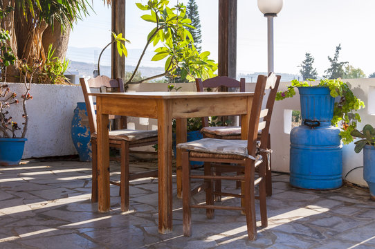 Table and chairs in a Taverne in the village Pitsidia on Crete