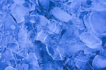 Thin layers of cool blue ice sheets, blue background.