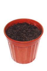 Planting pot filled with dirt on a white background