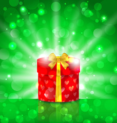 Christmas round gift box on light background with glow