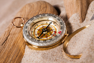 Fototapeta na wymiar compass on beach sand