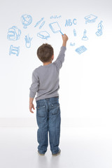 child holds a chalk in his hand © Dave_Pot