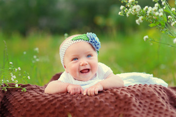 Happy baby girl in park