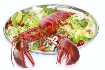 lobster with fresh herbs and lemon on a white background