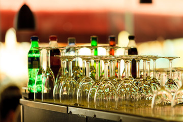 Empty glasses for wine on a bar rack