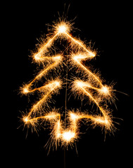 Christmas tree made by sparkler on a black