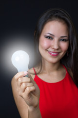 young girl with a bright idea light bulb