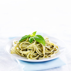 pesto pasta with basil shot in copy space composition