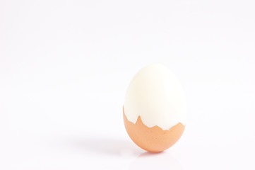 boiled egg with shell isolated on white background