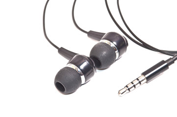 Headphones and jack isolated on white