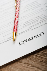 Pen on the contract papers
