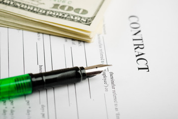 Pen on the contract papers and us dollars