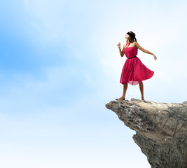 Woman on rock edge
