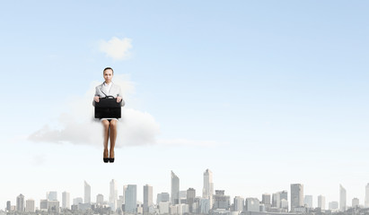 Fototapeta na wymiar Woman on cloud