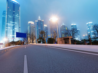 Asphalt road and modern city