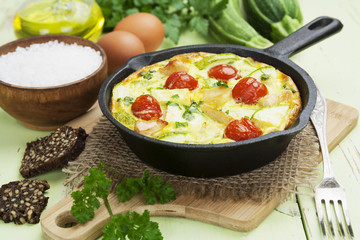 Zucchini baked with chicken, cherry tomatoes and herbs