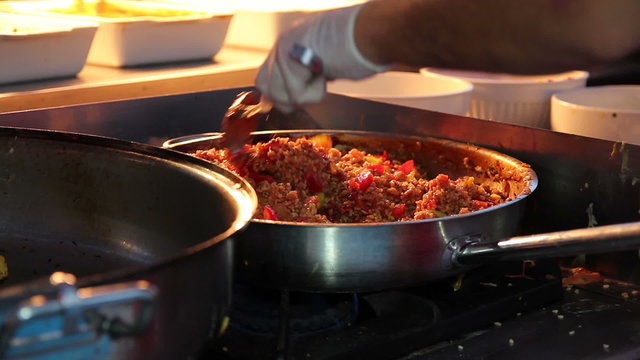 Professional Chef Cooking in Commercial Kitchen