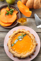 Homemade pumpkin pie on table