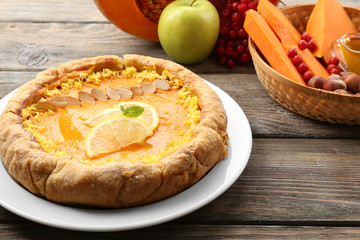 Homemade pumpkin pie on table