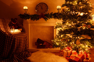 Christmas tree near fireplace in room