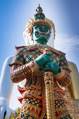 Green guardian statue at the Temple of Thailand
