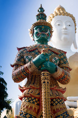 Green guardian statue at the Temple of Thailand