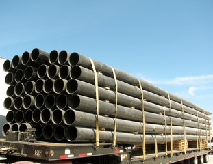Load of black PVC pipes