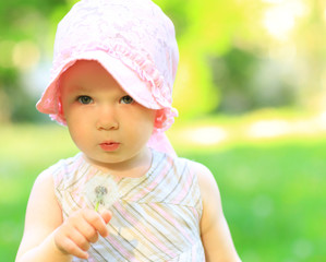 little girl with dandelions