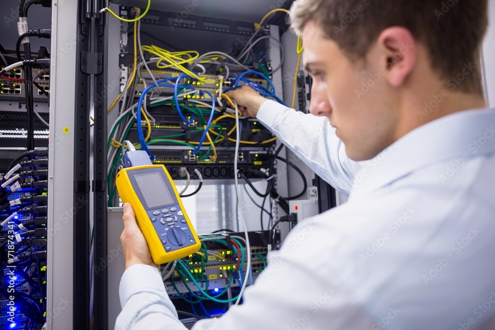 Aufkleber serious technician using digital cable analyzer on server