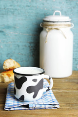 Retro still life with tasty rustic milk, on wooden table