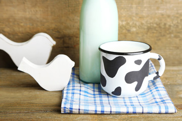 Retro still life with tasty rustic milk, on wooden table