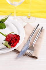 Fototapeta na wymiar Table setting with red rose on plate