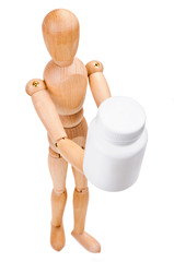 Wooden man hold a medical container with vitamins