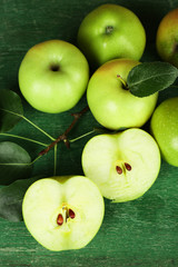 Ripe apples on wooden background