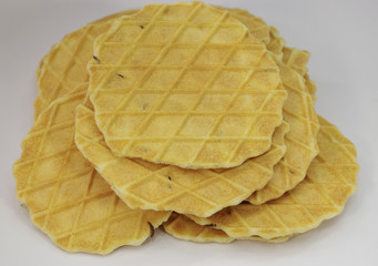 Salted pressed baking with caraway seeds on white background