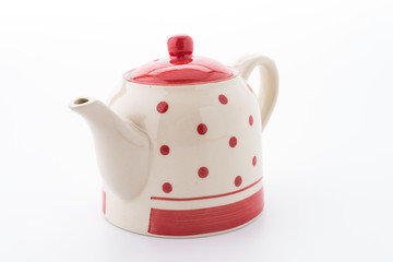 Polka dot tea pot isolated on white background