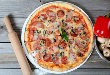 The Italian pizza with olives and a salami
