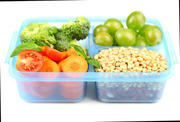 Tasty vegetarian food in plastic box, isolated on white