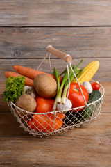 Fototapeta na wymiar Fresh organic vegetables on wooden background