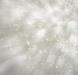 bokeh lights background with colors of white and silver and moti