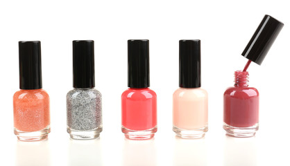 Colorful nail polishes isolated on white