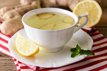 Ginger tea with lemon on table close-up