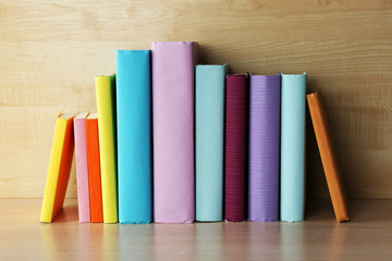Books on wooden shelf close-up