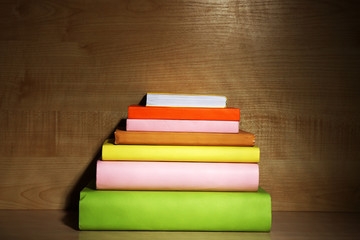 Books on wooden shelf close-up