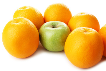 Juicy oranges and apple, close-up
