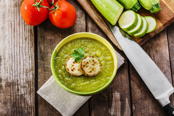 cream zucchini soup into a bowl