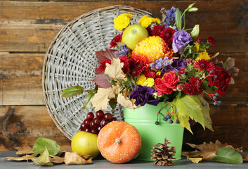 Beautiful autumn composition on wooden background