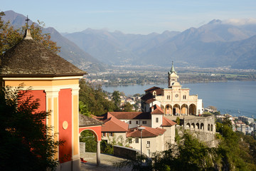 Fototapeta na wymiar Madonna del Sasso, medieval monastery on the rock overlook lake